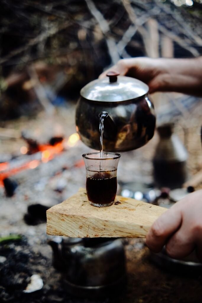 Close-up of traditional Turkish tea being poured outdoors, capturing the essence of Zonguldak's lifestyle.