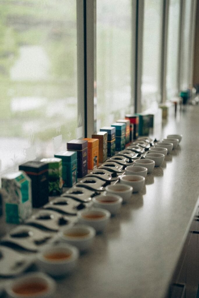 A diverse selection of teas ready for tasting at a scenic Sri Lankan tea factory.